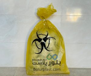 کیسه زباله زرد با نماد هشدار زیستی و نشان بلور پلاست